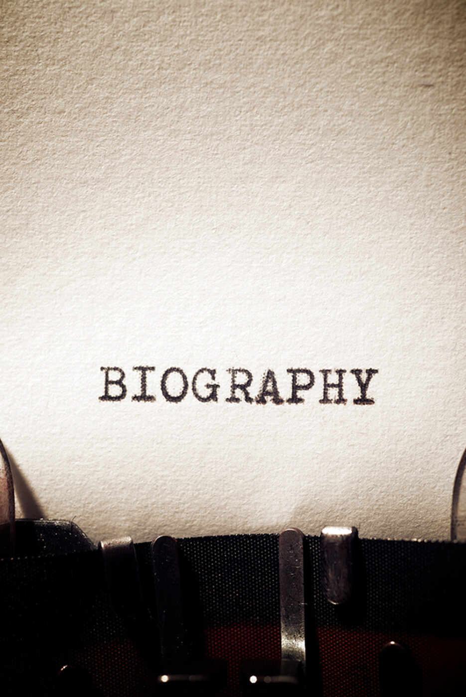 the start of a page on a typewriter and it says the word biography.