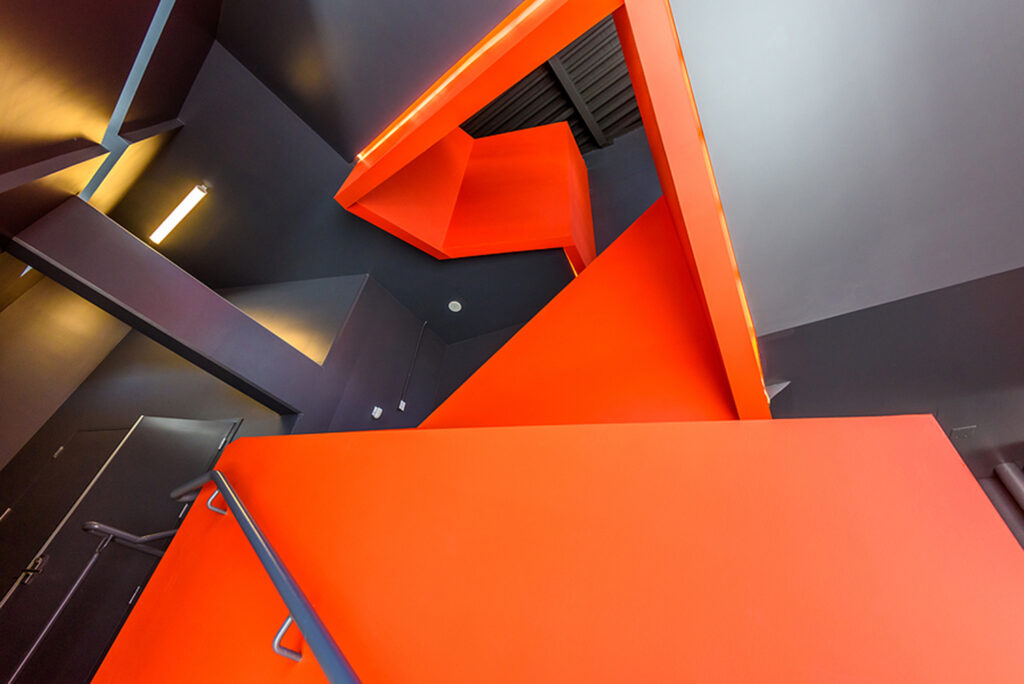 an angled set of red stairs.