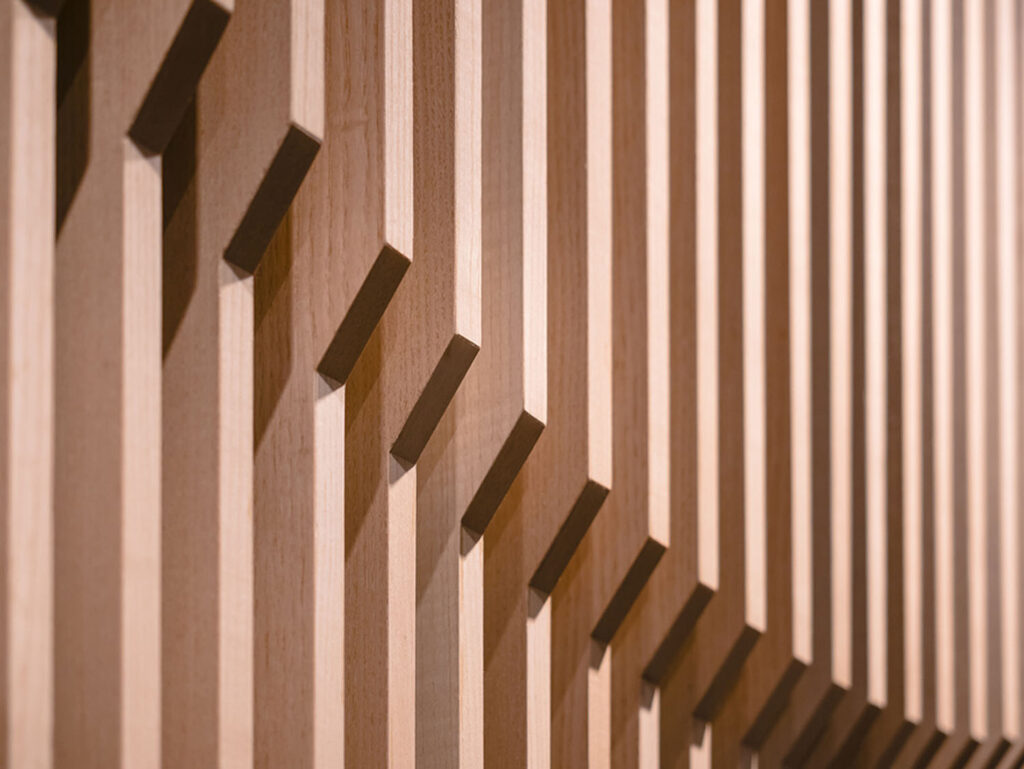 A picture of a wall of wood slats.