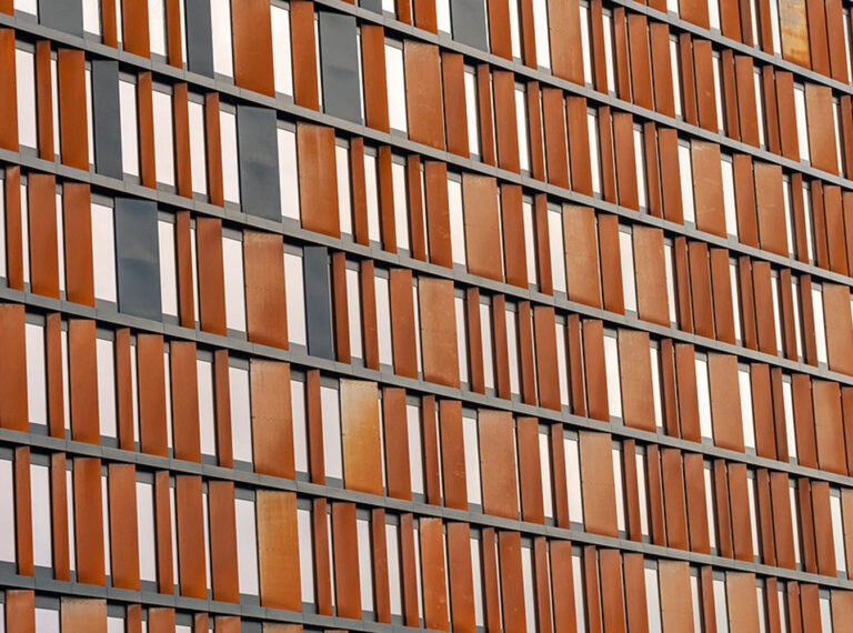 Facade of a modern office building with wooden shutters.