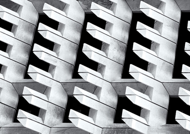 Concrete building with prongs in black and white.